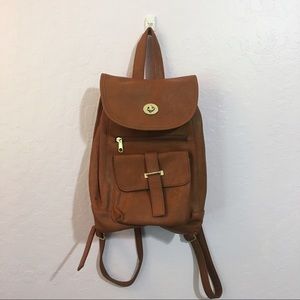 small brown faux leather backpack